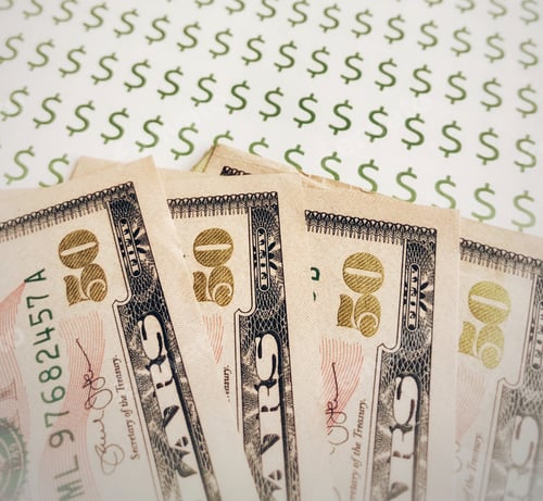 Preview: Fifty Dollar Bills on Patterned Money Signs Background for Financial and Economy Concept