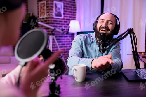 Preview: Male influencer having conversation with guest on podcast show