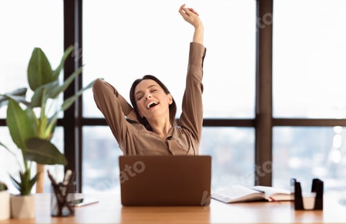 Preview: Happy american girl stretching body at modern office