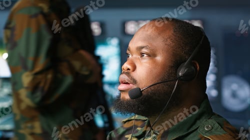 Preview: Radio communications operator talking in headset mic, close up