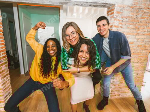 Preview: Energetic multicultural team posing playfully at the office