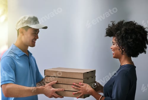 Preview: Shot of a happy businesswoman accepting a pizza delivery from a delivery man in the office