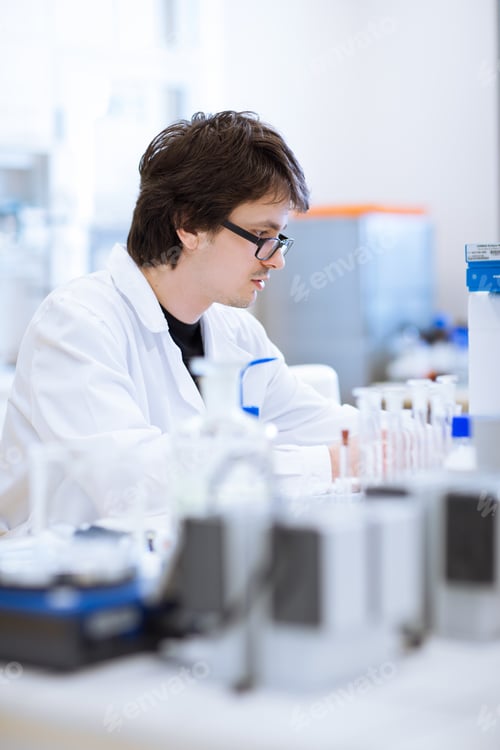 Preview: young, male researcher/chemistry student carrying out scientific