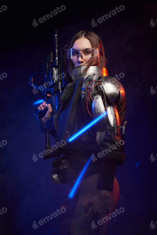 Preview: Seductive and martial female person with rifle in dark background