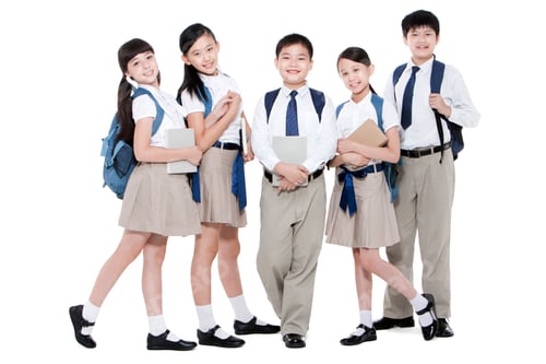 Preview: Happy primary school friends with books and schoolbags