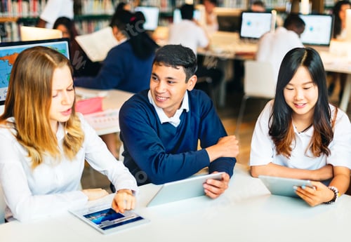 Preview: Students learning in group at the library