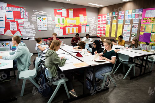 Preview: Group of students learning in classroom