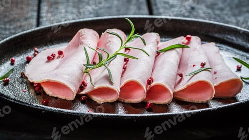 Preview: Closeup of fresh ham on black buried board