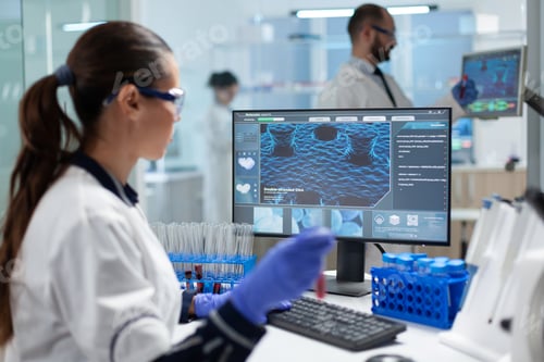 Preview: Specialist biologist researcher holding blood medical test tubes analyzing virus diagnostic