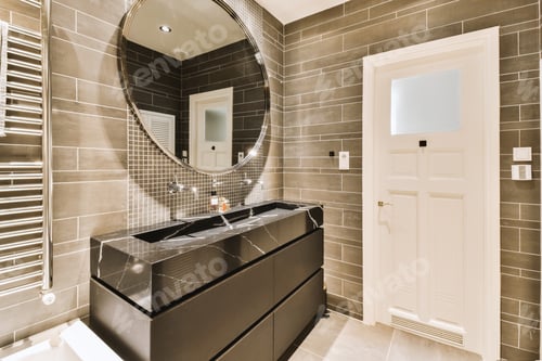 Preview: a bathroom with a large mirror and a black sink
