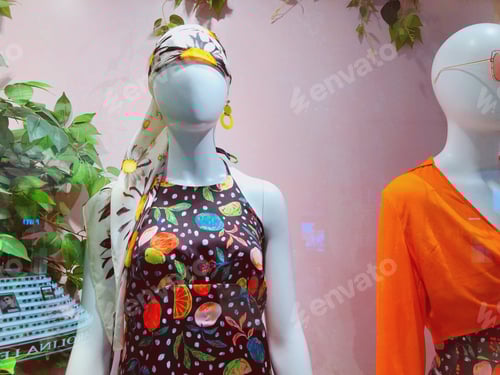 Preview: Mannequins Displaying Colorful Summer Fashion Clothing in Window