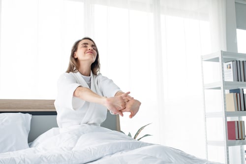 Preview: Caucasian woman in the morning on the white bed.