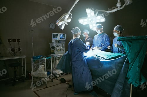 Preview: Surgeons Operating in Brightly Lit Hospital Operating Room