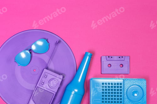Preview: Colorful retro items arranged on a bright pink background in a playful scene