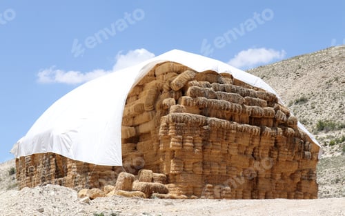 Preview: hay bales stacked on the hill