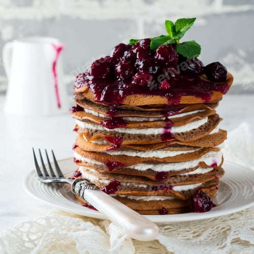 Preview: Pancake chocolate cake with cottage cheese filling and cherry sauce on a light background. Selective