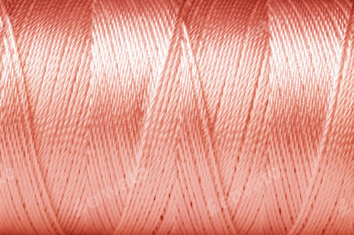 Preview: Texture of rose gold thread, closeup view
