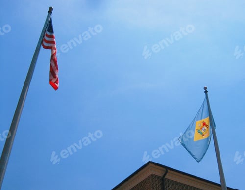 Preview: The flags of United States and Delaware on a beautiful blue sky background