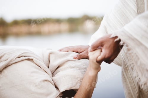 Preview: Closeup shot of Jesus Christ healing the female with a blurred background