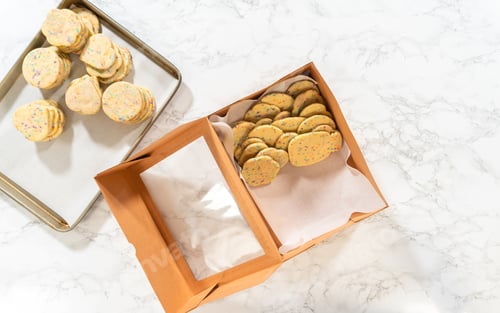 Preview: Packing Sprinkle-Adorned Sugar Cookies into Boxes