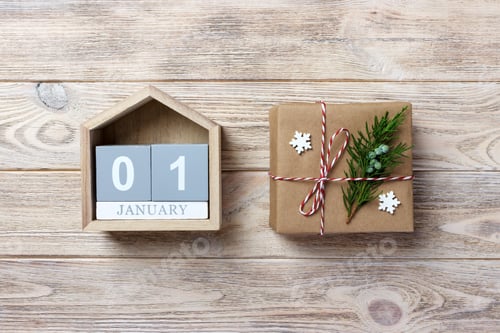 Preview: Christmas calendar. Christmas gift, fir branches on wooden white background. Copy space, top view