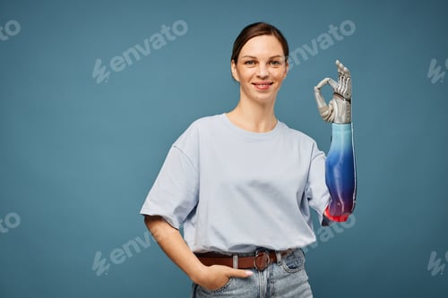 Preview: Woman with Bionic Arm Showing OK Sign