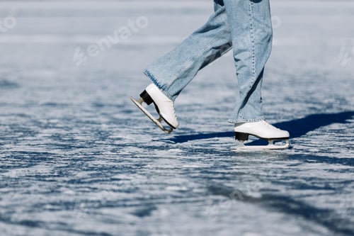 Preview: Person ice skating on frozen lake surface