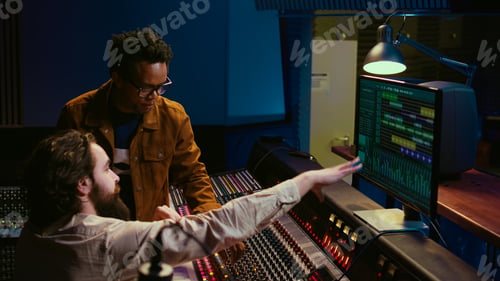 Preview: Team of artists collaborating on editing recorded tracks with audio software