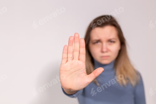 Preview: Abuse, domestic violence, protesting and people concept - Stop violence against women on grey