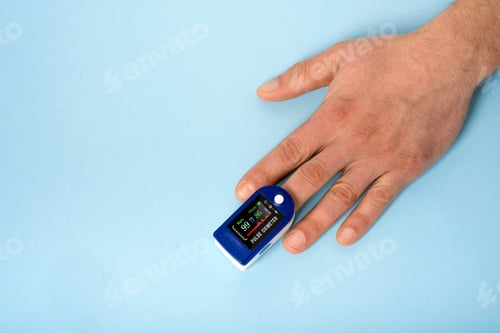Preview: Human hand pulse oximeter used to measure pulse rate and oxygen levels