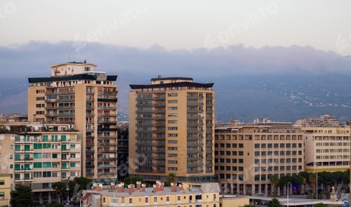 Preview: Residential Homes in city with mountains in background in Palermo, Sicily, Italy.