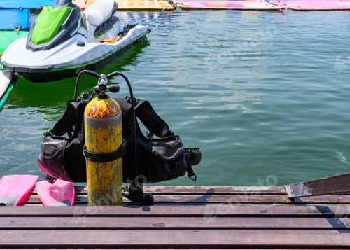Preview: Oxygen tank with life jacket and fins on metal stairs