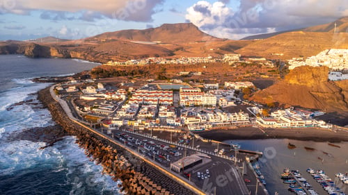 Preview: Aerial view of the town Agaete and its Puerto de las Nieves at summer sunset in Gran Canaria. Spain