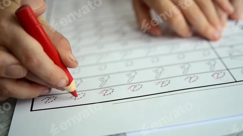 Preview: Father teaching child to write letters