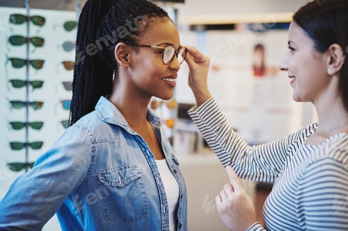 Preview: Optometrist helping a pretty African client