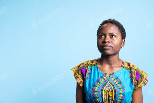 Preview: Portrait of serious confident young woman posing in studio