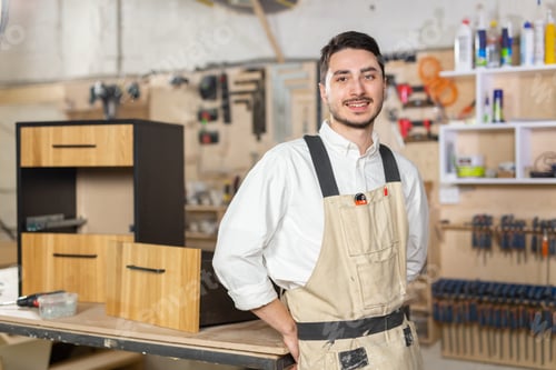 Preview: furniture factory, Small-Sized Companies and people concept - Portrait of a smiling male worker at