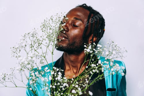 Preview: fine art concept of a man smelling white flowers