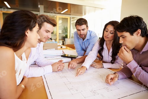 Preview: Group Of Architects Discussing Plans In Modern Office