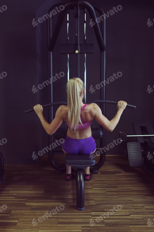 Preview: Strong and beautiful athletic woman training in the gym