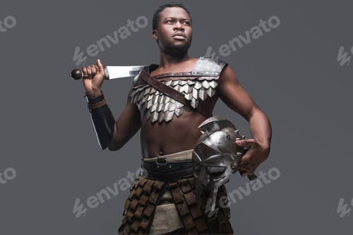 Preview: Violent gladiator with sword against gray background