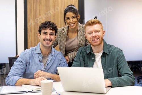 Preview: Diverse startup team collaborating in modern office meeting