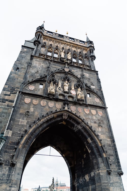 Preview: Old Town Bridge Tower in Charles Bridge in Prague against sky at sunrise. Czech Republic.