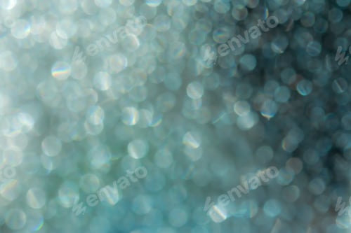 Preview: Abstract blue shiny background with bokeh. The concept of the winter holidays.