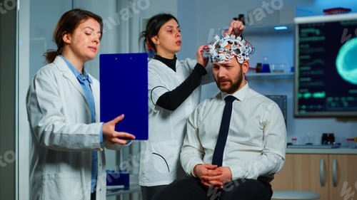 Preview: Neuroscience doctor showing on clipboard treatment against brain disease