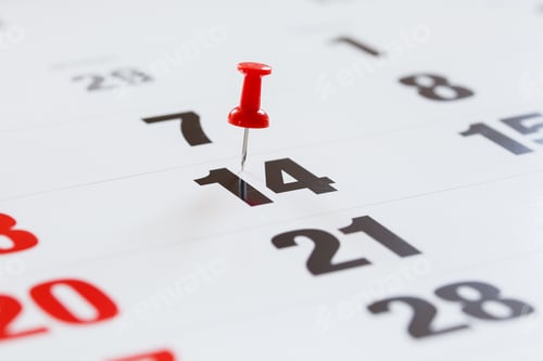 Preview: Pin pushed on a calendar concept for an important day.