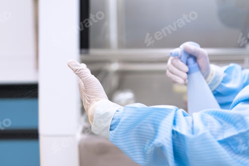 Preview: Close up of microbiologist or medical technologist's hand is spraying disinfectant to clean the hand