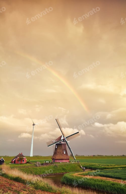Preview: rainbow over Dutch windmill at sunset