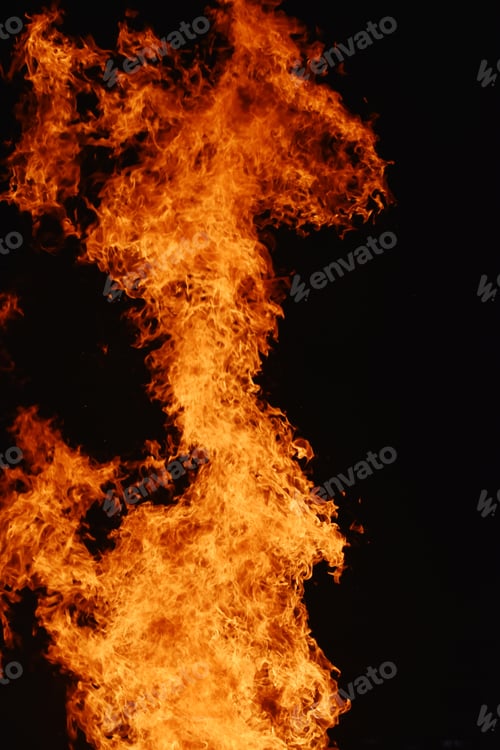 Preview: Vertical closeup shot of campfire at the time of festival