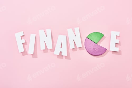 Preview: top view of finance inscription with color pie diagram instead e letter on pink background